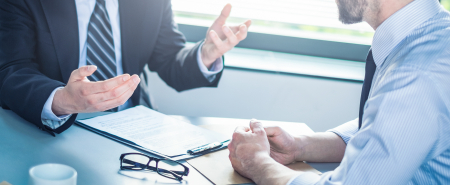 Business people negotiating a contract.
